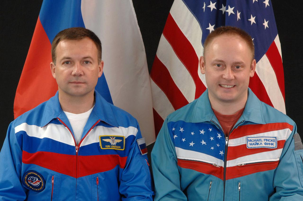 JSC2008-E-117654 (28 Aug. 2008) --- NASA astronaut Michael Fincke (right) and Russian Federal Space Agency cosmonaut Yury Lonchakov, Expedition 18 commander and flight engineer, respectively, take a break from training in Star City, Russia to pose for a portrait. Photo credit: Gagarin Cosmonaut Training Center