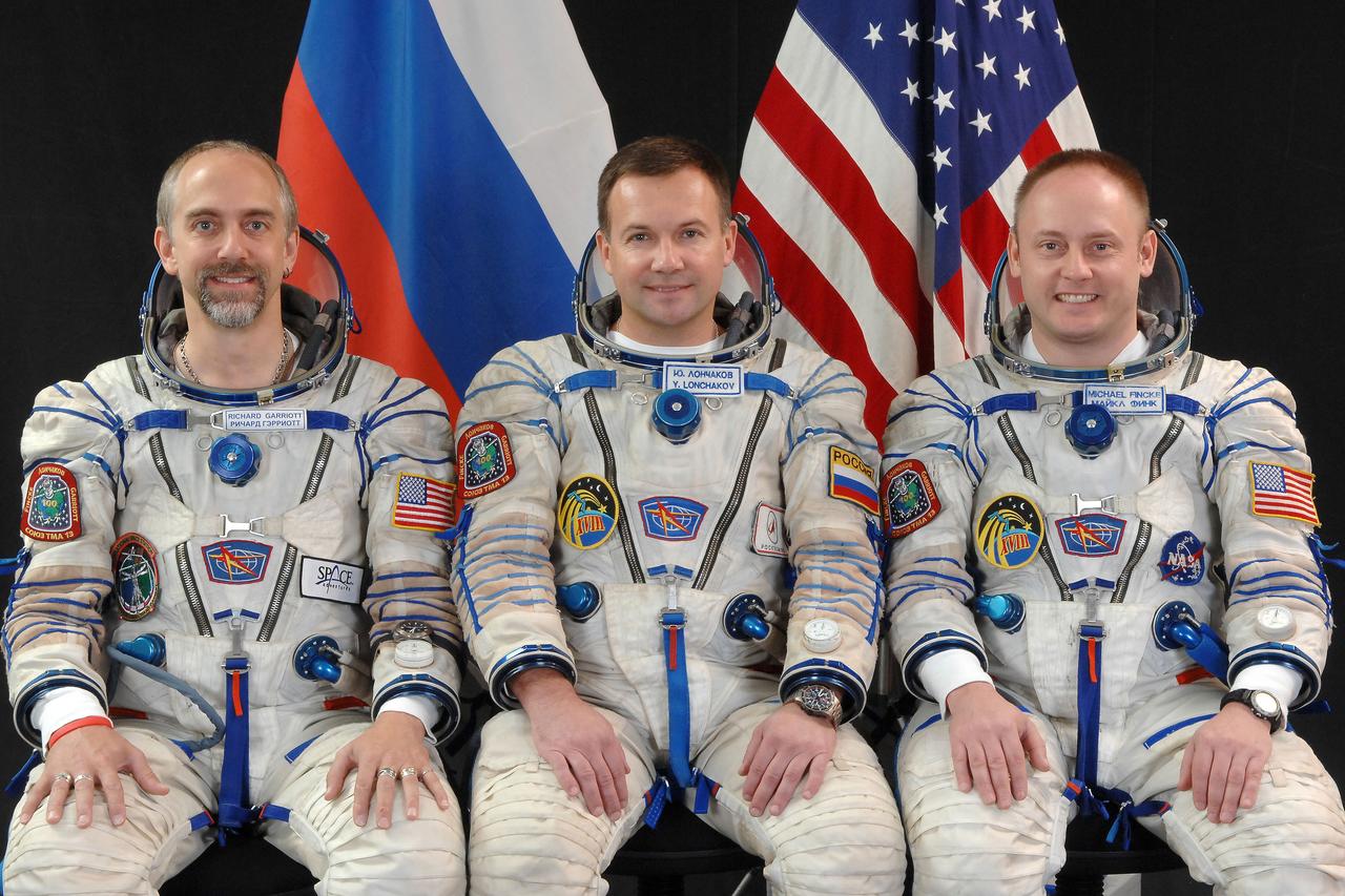 JSC2008-E-117656 (28 Aug. 2008) --- Attired in Russian Sokol launch and entry suits, NASA astronaut Michael Fincke (right), Expedition 18 commander; Russian Federal Space Agency cosmonaut Yury Lonchakov (center), flight engineer; and American spaceflight participant Richard Garriott take a break from training in Star City, Russia to pose for a portrait. Fincke, Lonchakov and Garriott are scheduled to launch to the International Space Station in a Soyuz spacecraft in October. Photo credit: Gagarin Cosmonaut Training Center