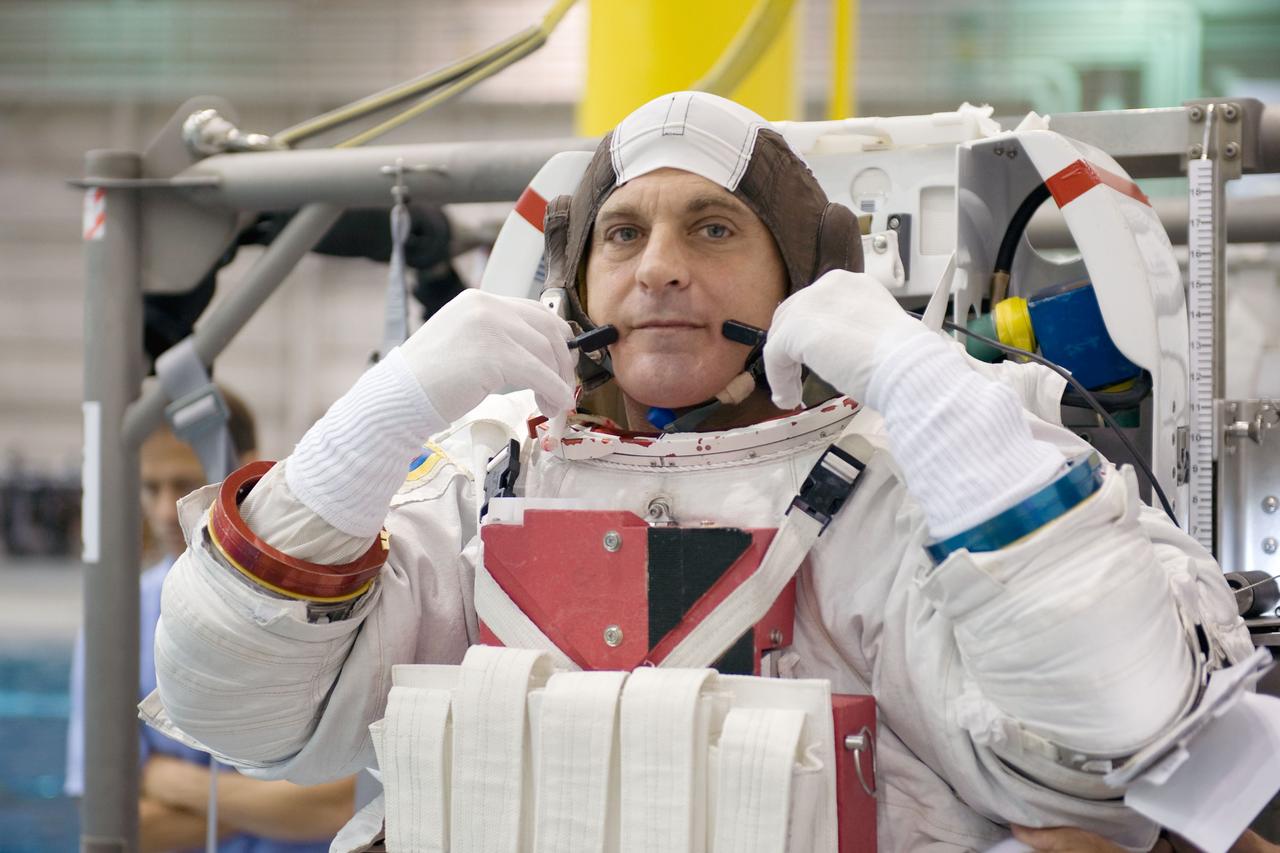 JSC2008-E-122389 (9 Oct. 2008) --- Attired in a training version of his Extravehicular Mobility Unit (EMU) spacesuit, astronaut Dave Wolf, STS-127 mission specialist, awaits the start of a training session in the waters of the Neutral Buoyancy Laboratory (NBL) near NASA's Johnson Space Center.