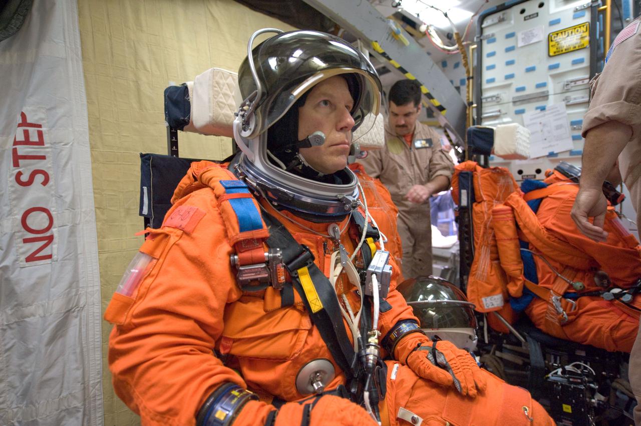 JSC2008-E-122436 (7 Oct. 2008) --- Astronaut Tim Kopra, STS-127 mission specialist, participates in a training session in one of the full-scale trainers in the Space Vehicle Mockup Facility at NASA's Johnson Space Center. Attired in a training version of his shuttle launch and entry suit, Kopra is seated on the middeck for a post insertion/de-orbit training session. Kopra is scheduled to join Expedition 19 as flight engineer after launching to the International Space Station with the STS-127 crew.