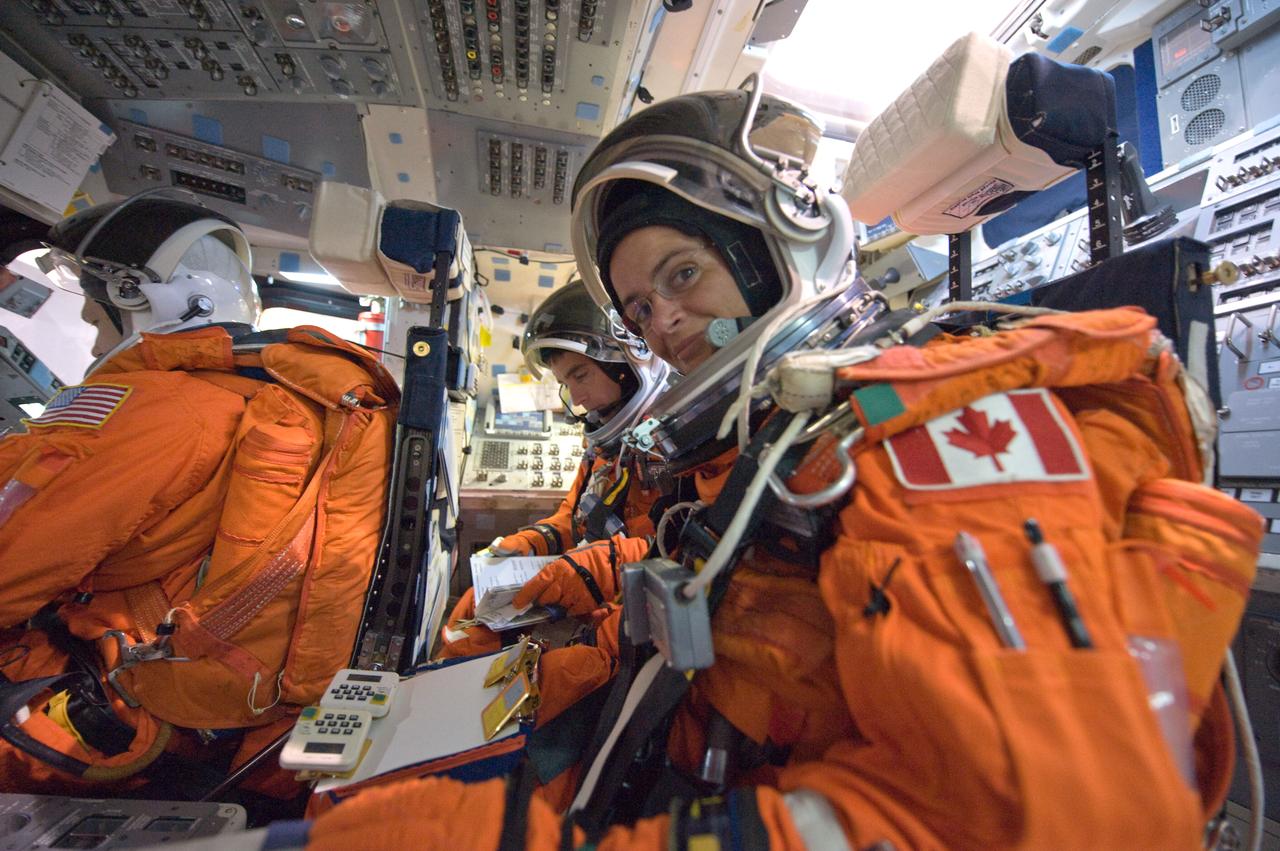 JSC2008-E-122442 (7 Oct. 2008) --- Canadian Space Agency astronaut Julie Payette (foreground), NASA astronaut Christopher Cassidy, both STS-127 mission specialists, and astronaut Doug Hurley (left), pilot, participate in a training session in one of the full-scale trainers in the Space Vehicle Mockup Facility at NASA's Johnson Space Center. Attired in training versions of their shuttle launch and entry suits, the crewmembers are seated on the flight deck for a post insertion/de-orbit training session.