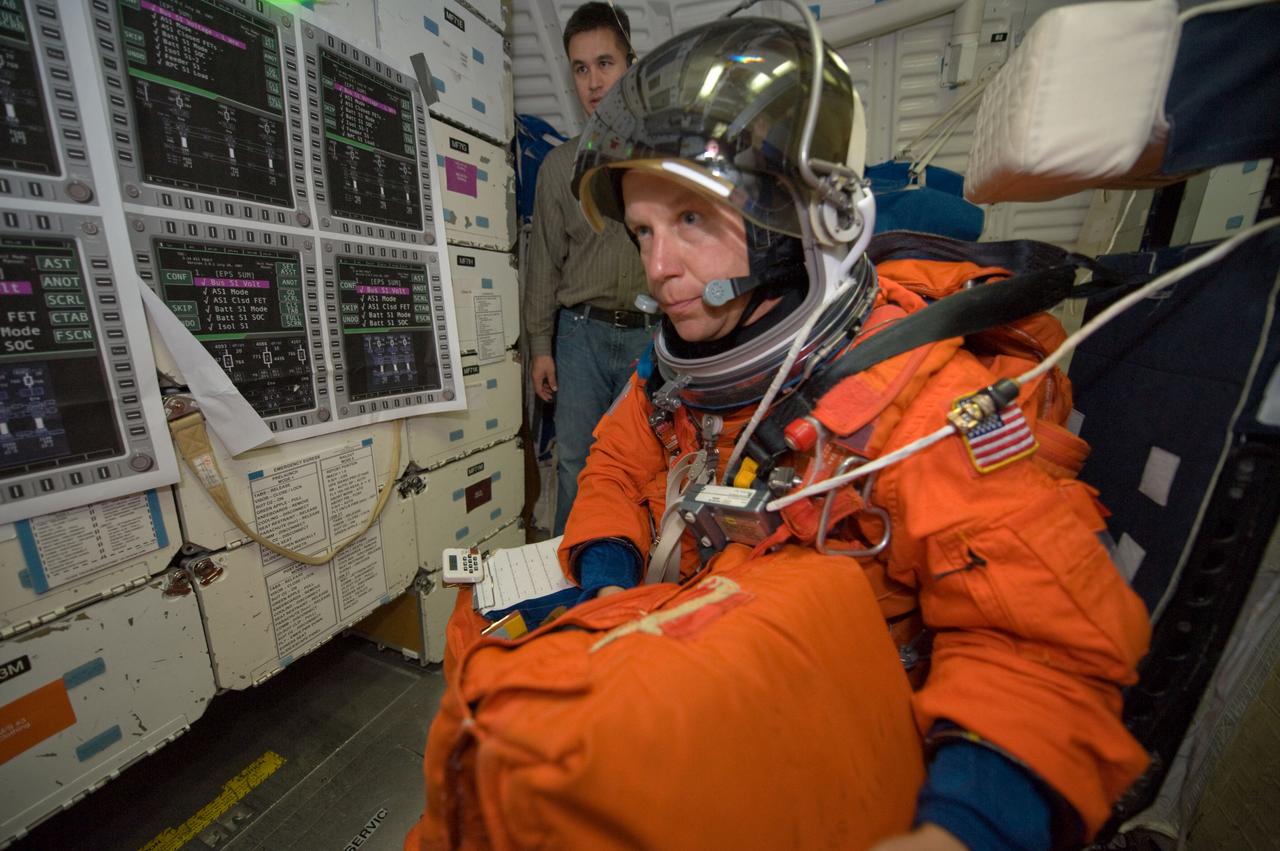 JSC2008-E-122445 (7 Oct. 2008) --- Astronaut Tim Kopra, STS-127 mission specialist, participates in a training session in one of the full-scale trainers in the Space Vehicle Mockup Facility at NASA's Johnson Space Center. Attired in a training version of his shuttle launch and entry suit, Kopra is seated on the middeck for a post insertion/de-orbit training session. Kopra is scheduled to join Expedition 19 as flight engineer after launching to the International Space Station with the STS-127 crew.