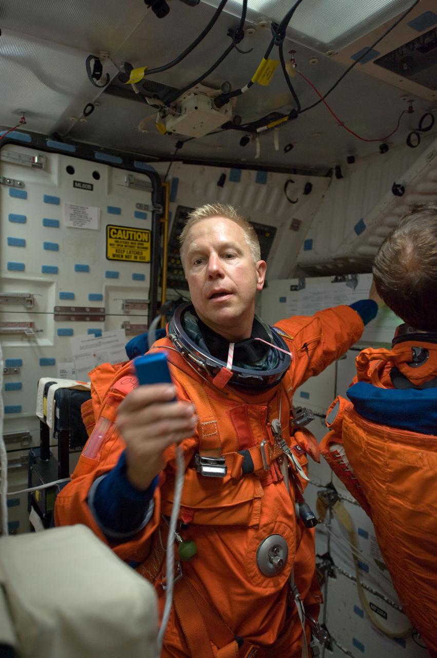 JSC2008-E-122456 (7 Oct. 2008) --- Attired in a training version of his shuttle launch and entry suit, astronaut Tim Kopra, STS-127 mission specialist, participates in a training session in one of the full-scale trainers in the Space Vehicle Mockup Facility at NASA's Johnson Space Center. Kopra is scheduled to join Expedition 19 as flight engineer after launching to the International Space Station with the STS-127 crew.