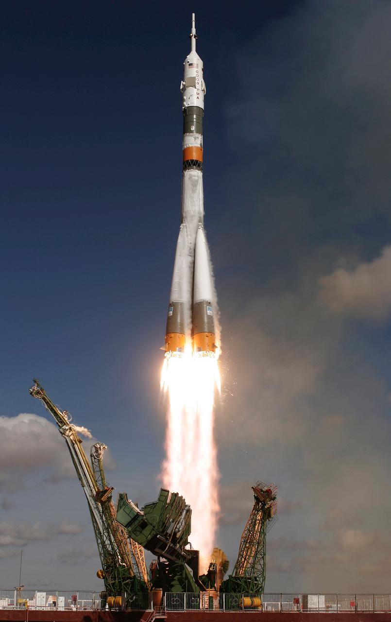 The Soyuz TMA-13 spacecraft, carrying Expedition 18 Commander Michael Fincke, Flight Engineer Yury V. Lonchakov and American Spaceflight Participant Richard Garriott, launches, Sunday, Oct. 12, 2008, from the Baikonur Cosmodrome in Kazakhstan. The three crew members are scheduled to dock with the International Space Station on Oct. 14. Fincke and Lonchakov will spend six months on the station, while Garriott will return to Earth Oct. 24, 2008 with two of the Expedition 17 crewmembers currently on the International Space Station. Photo Credit: (NASA/Bill Ingalls)