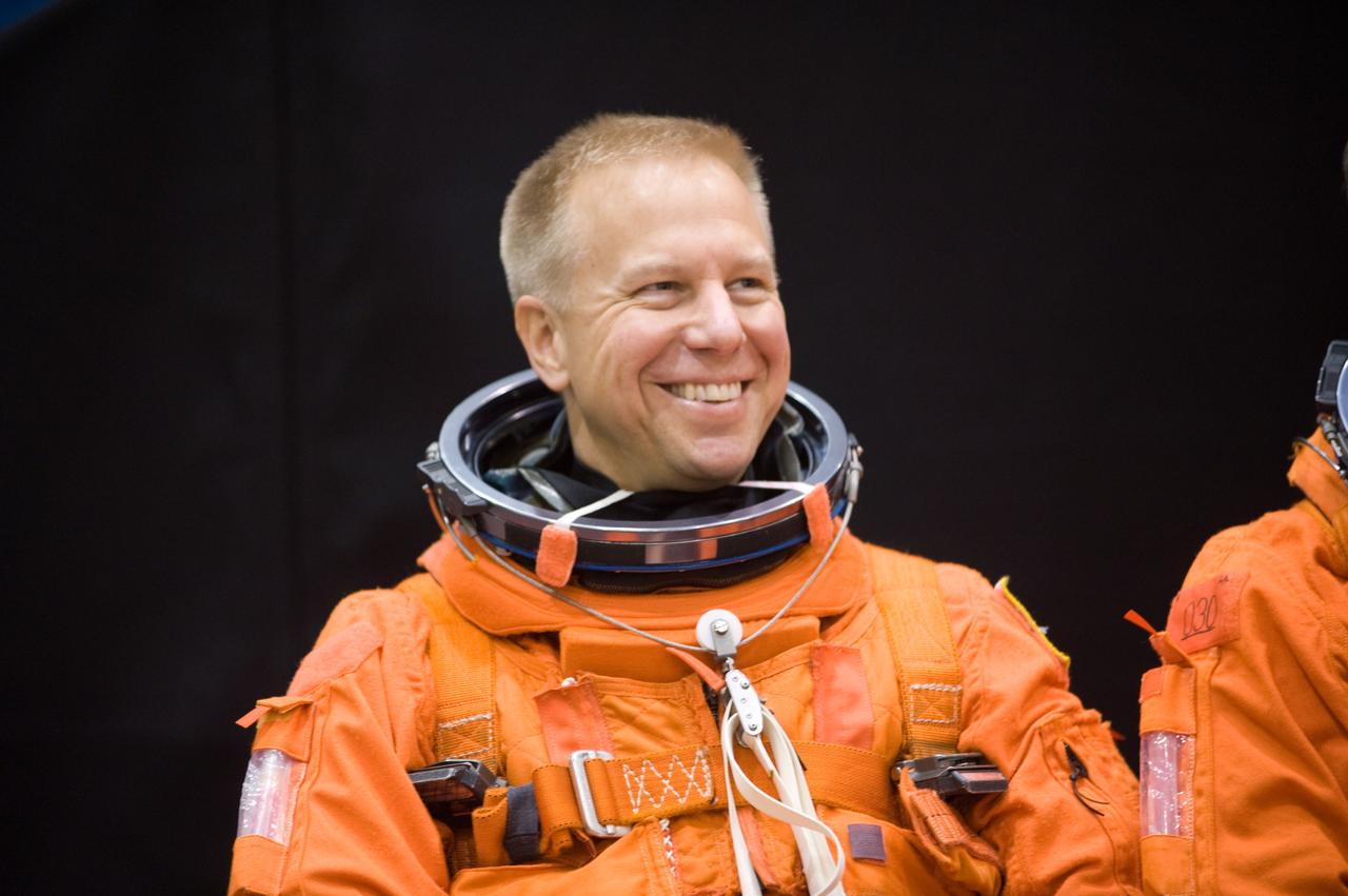 JSC2008-E-139790 (12 Nov. 2008) --- Astronaut Tim Kopra, STS-127 mission specialist, attired in a training version of his shuttle launch and entry suit, awaits the start of a training session in the Space Vehicle Mock-up Facility at NASA's Johnson Space Center. Kopra is scheduled to join Expedition 19 as flight engineer after launching to the International Space Station with the STS-127 crew.