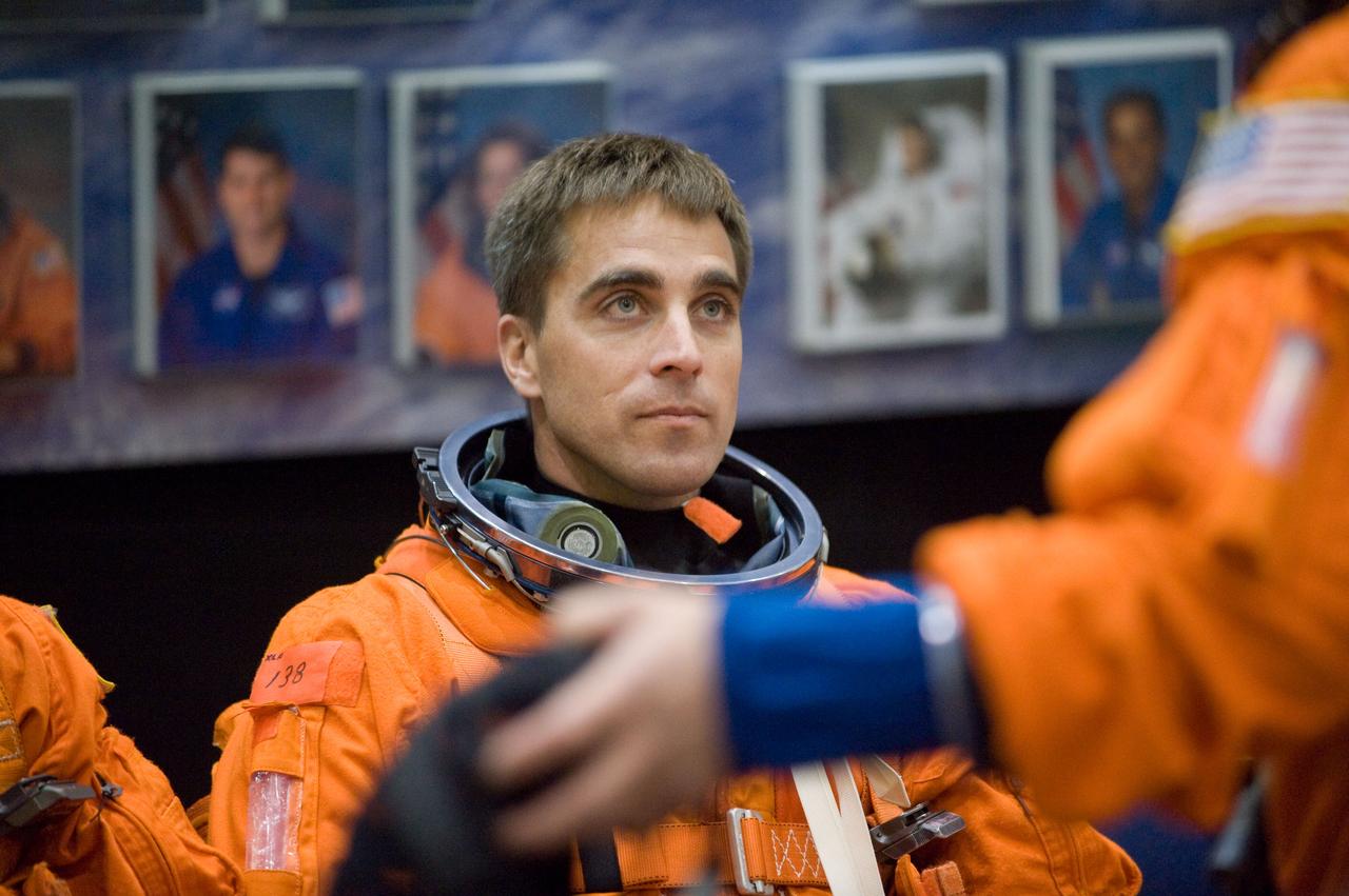 JSC2008-E-139792 (12 Nov. 2008) --- Astronaut Christopher Cassidy, STS-127 mission specialist, attired in a training version of his shuttle launch and entry suit, awaits the start of a training session in the Space Vehicle Mock-up Facility at NASA's Johnson Space Center.