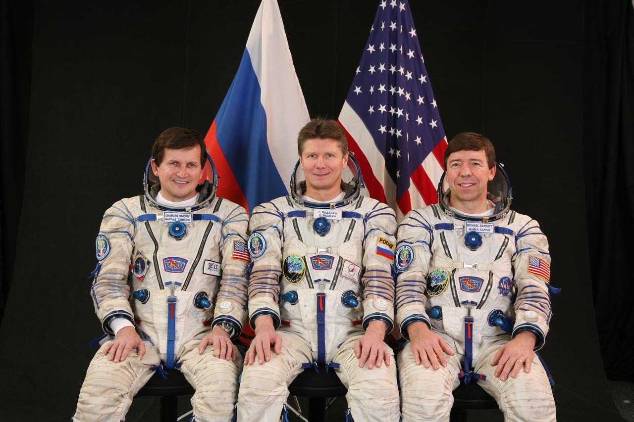 JSC2009-E-049974 (February 2009) --- Attired in Russian Sokol launch and entry suits, cosmonaut Gennady Padalka (center), Expedition 19/20 commander; astronaut Michael Barratt (right), Expedition 19/20 flight engineer; and U.S. spaceflight participant Charles Simonyi take a break from training in Star City, Russia to pose for a portrait. Photo credit: Gagarin Cosmonaut Training Center
