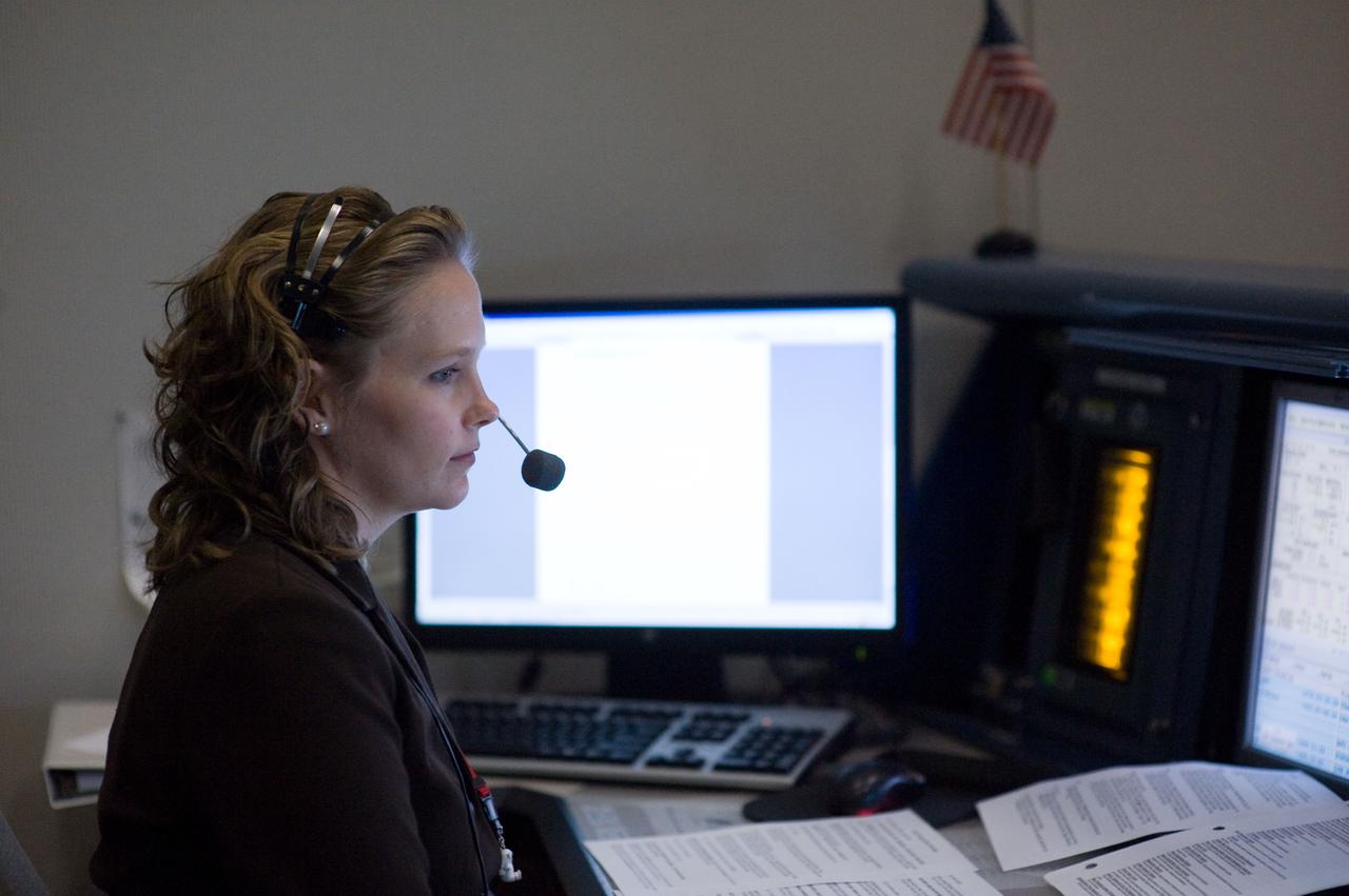 PHOTO DATE: 03-15-09 LOCATION: Bldg 30 - WFCR SUBJECT: Ascent flight controlers work at their consoles during the STS-119 Launch. PHOTOGRAPHER: Devin Boldt