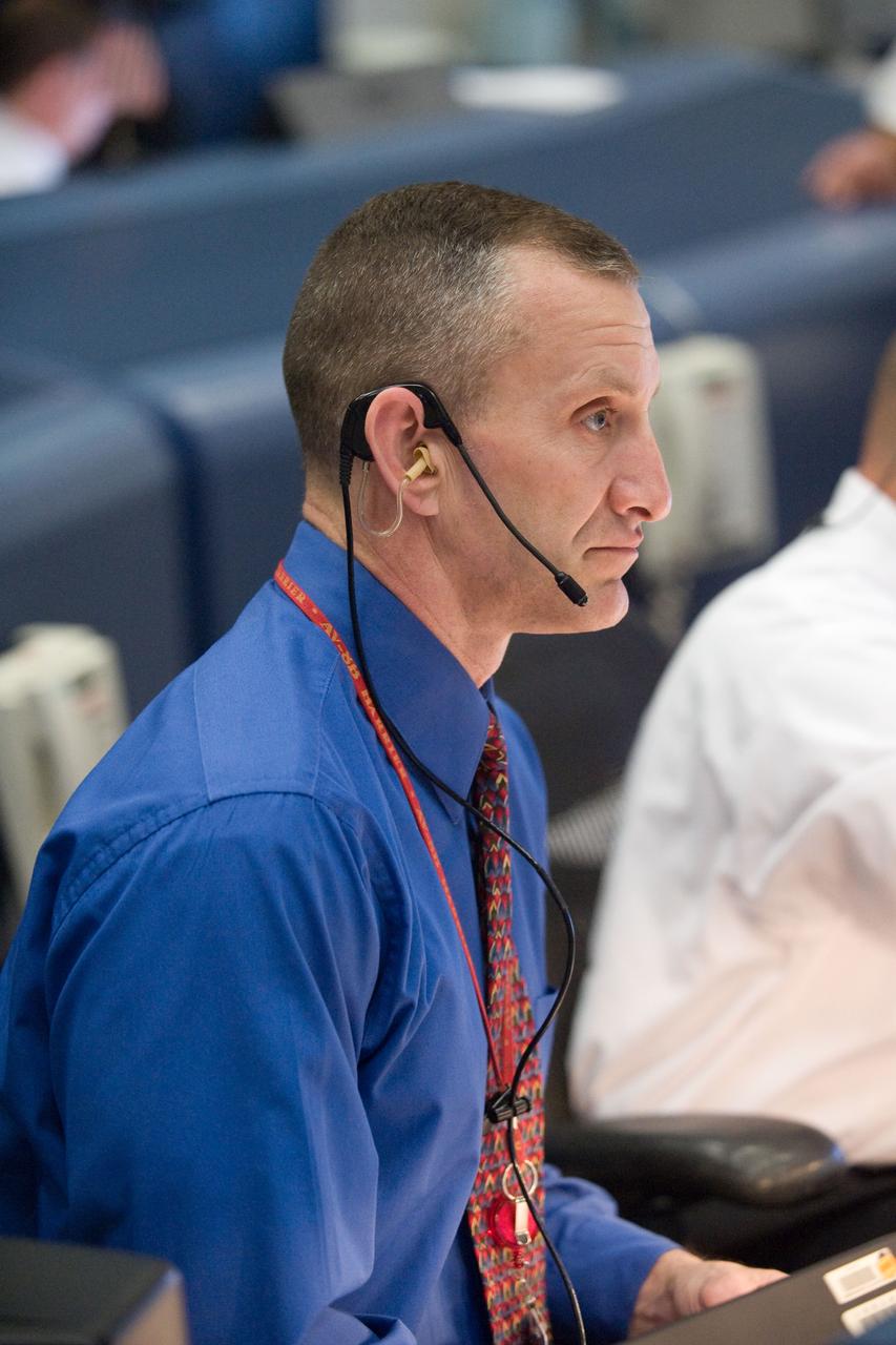PHOTO DATE:  03-15-09 LOCATION: Bldg. 30 south , WFCR, MER  SUBJECT: STS-119 Flight Controllers on Console - Launch PHOTOGRAPHER: BLAIR, BOLDT & HARNETT