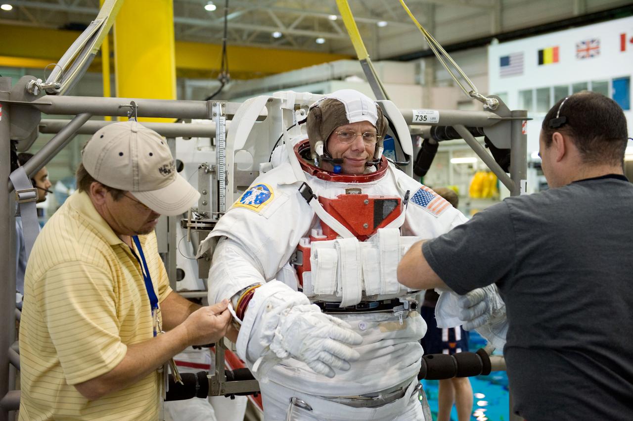 PHOTO DATE:  03-23-09 LOCATION: SCTF, NBL SUBJECT: Preflight coverage of STS-128 crew members Danny Olivas and Christer Fuglesang during STS-128 17A TPS Ops 91027 PHOTOGRAPHER:  BLAIR
