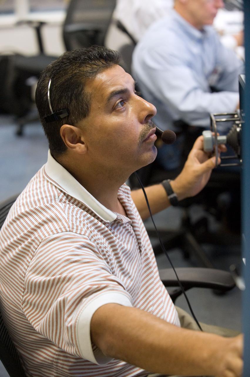 PHOTO DATE:  03-23-09 LOCATION: SCTF, NBL SUBJECT: Preflight coverage of STS-128 crew members Danny Olivas and Christer Fuglesang during STS-128 17A TPS Ops 91027 PHOTOGRAPHER:  BLAIR