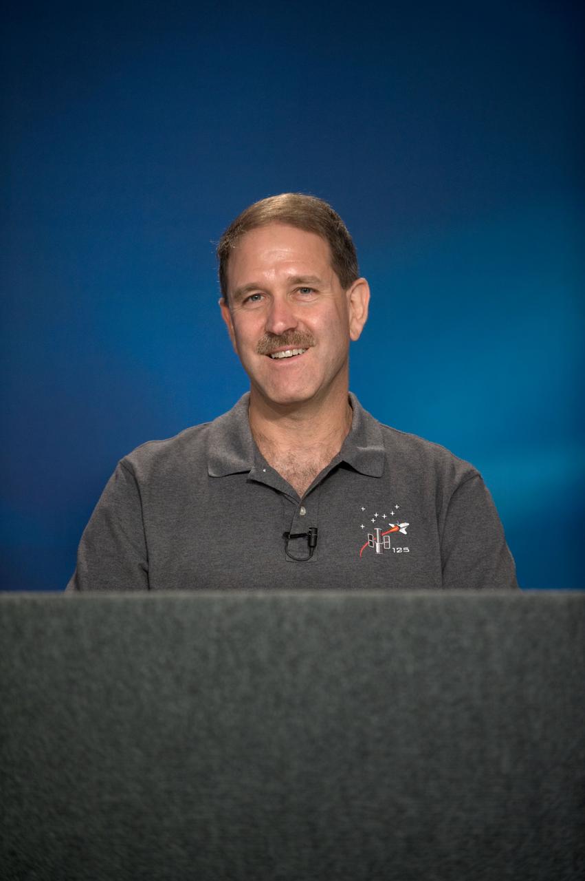 JSC2009-E-087200 (23 April 2009) --- Astronaut John Grunsfeld, STS-125 mission specialist, fields a question from a reporter during a STS-125 preflight press briefing at NASA's Johnson Space Center.
