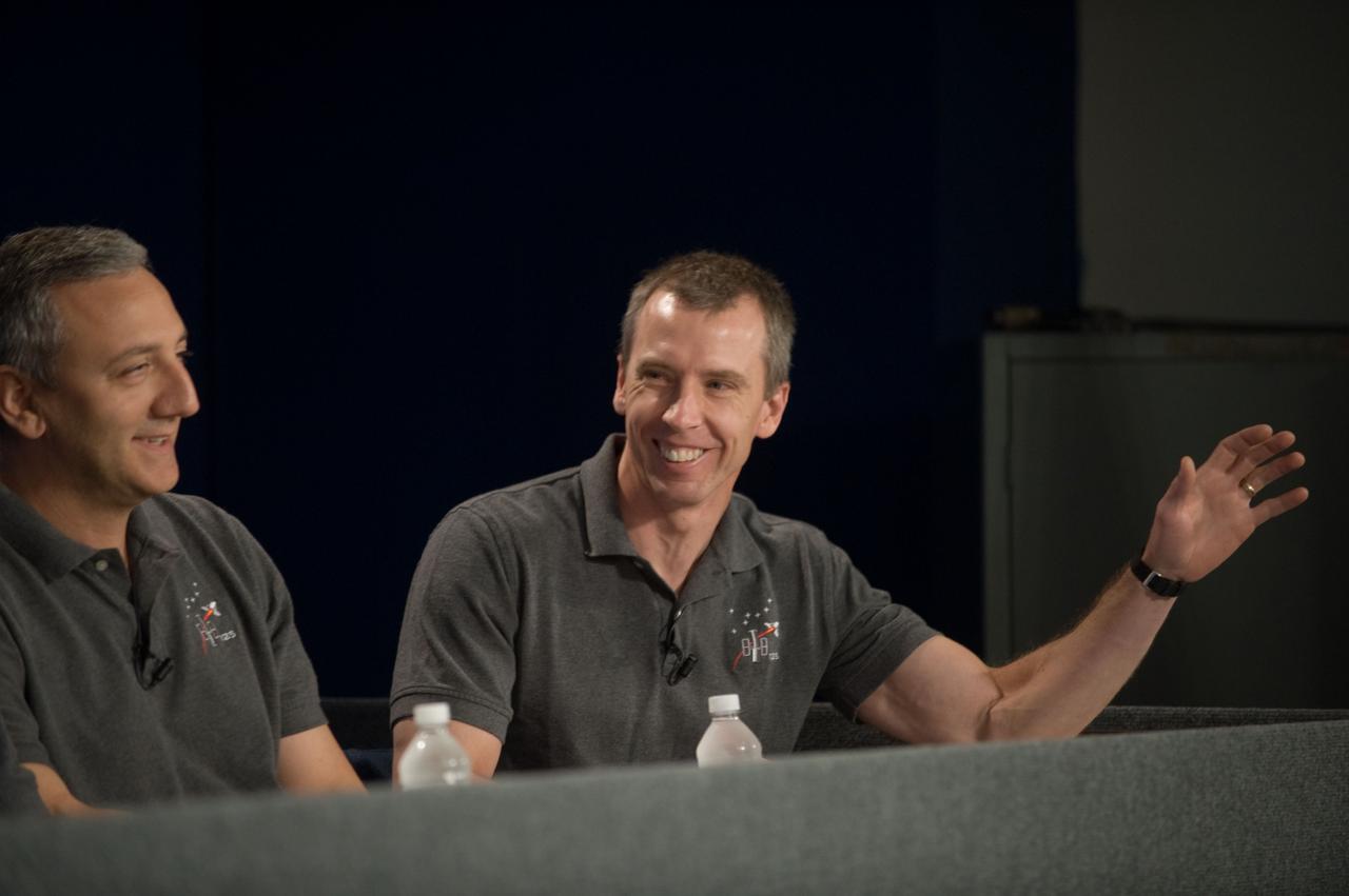 JSC2009-E-087212 (23 April 2009) --- Astronauts Mike Massimino (left) and Andrew Feustel, both STS-125 mission specialists, are pictured during a STS-125 preflight press briefing at NASA's Johnson Space Center.