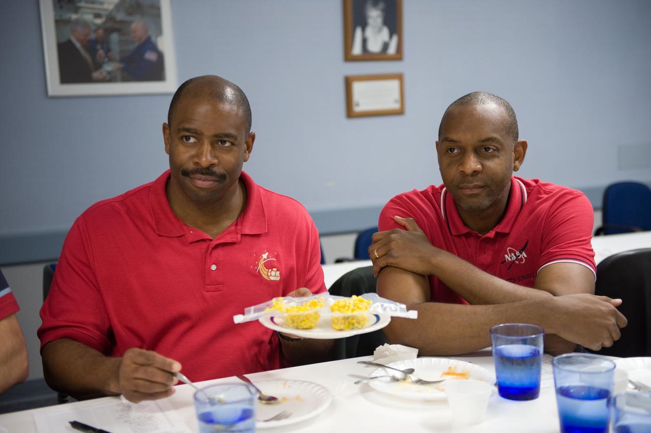 JSC2009-E-107056 (4 May 2009) --- Astronauts Leland Melvin (left) and Robert Satcher, both STS-129 mission specialists, participate in a food tasting session in the Habitability and Environmental Factors Office at NASA's Johnson Space Center.