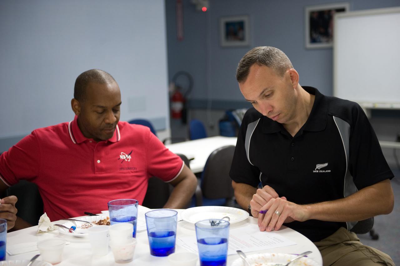 JSC2009-E-107059 (4 May 2009) --- Astronauts Robert Satcher (left) and Randy Bresnik, both STS-129 mission specialists, participate in a food tasting session in the Habitability and Environmental Factors Office at NASA's Johnson Space Center.