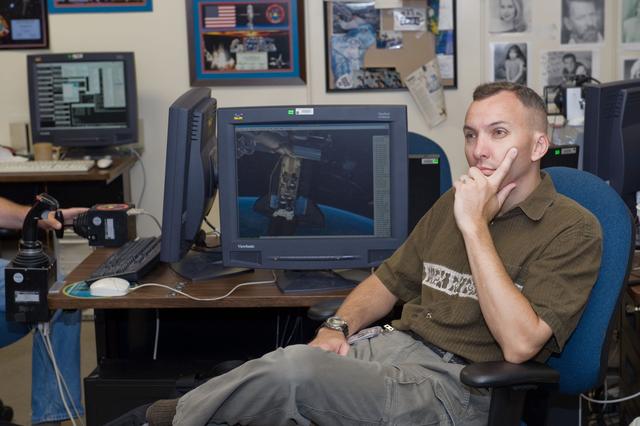 NASA image: STS-129 crew training in the JSC VR lab during SSRMS refresher training. 