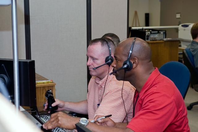 NASA image: STS-129 crew training in the JSC VR lab during SSRMS refresher training. 