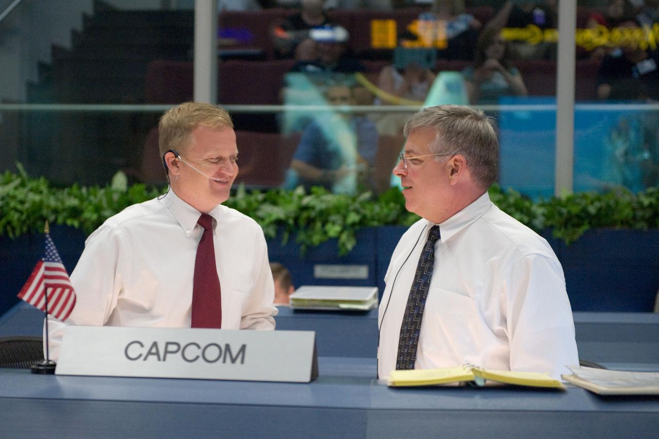 JSC2009-E-118860 (11 May 2009) --- Astronauts Eric Boe (left) and Gregory H. Johnson, STS-125 spacecraft communicators (CAPCOM), are pictured in the space shuttle flight control room in the Mission Control Center at NASA's Johnson Space Center during launch countdown activities a few hundred miles away in Florida, site of Space Shuttle Atlantis? scheduled STS-125 launch to service the Hubble Space Telescope. Liftoff was on time at 2:01 p.m. (EDT) on May 11, 2009 from launch pad 39A at NASA's Kennedy Space Center.