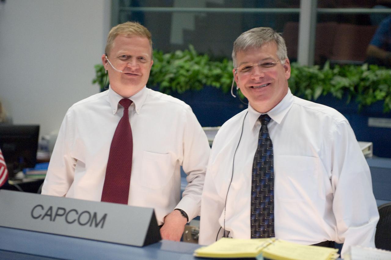 JSC2009-E-118861 (11 May 2009) --- Astronauts Eric Boe (left) and Gregory H. Johnson, STS-125 spacecraft communicators (CAPCOM), are pictured in the space shuttle flight control room in the Mission Control Center at NASA's Johnson Space Center during launch countdown activities a few hundred miles away in Florida, site of Space Shuttle Atlantis? scheduled STS-125 launch to service the Hubble Space Telescope. Liftoff was on time at 2:01 p.m. (EDT) on May 11, 2009 from launch pad 39A at NASA's Kennedy Space Center.