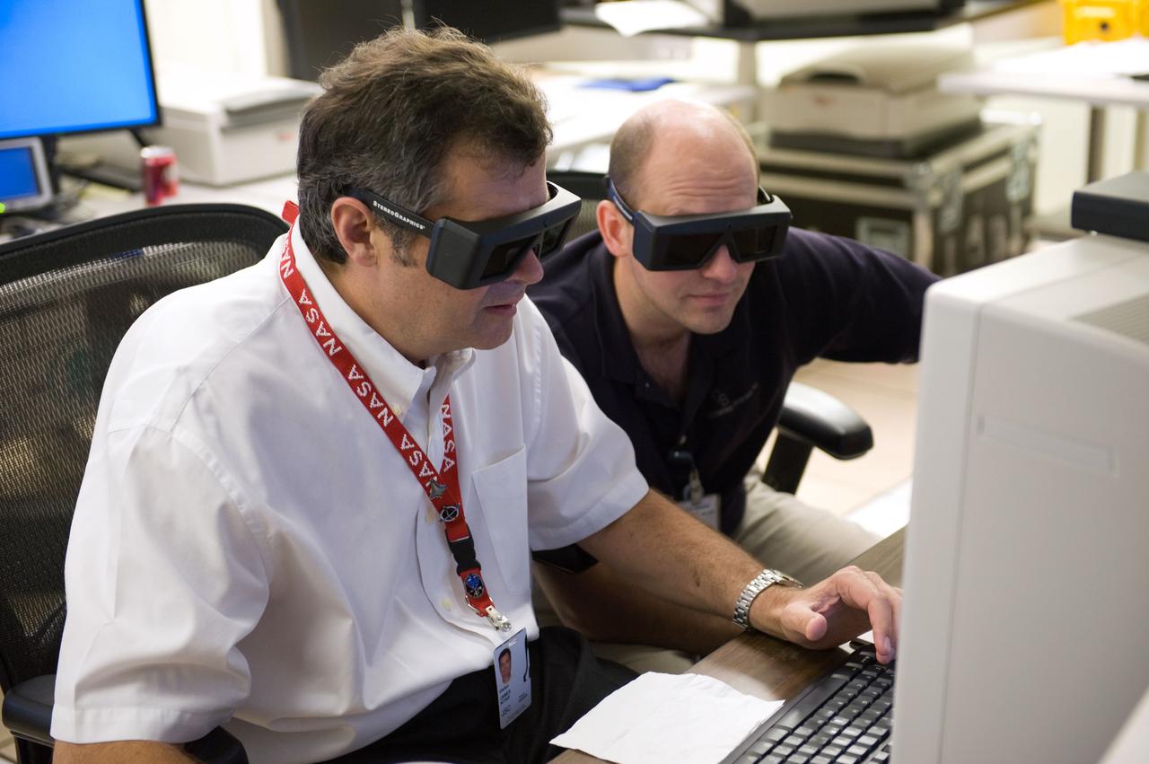 PHOTO DATE:  05-12-09 LOCATION: Bldg. 30 south - (Rooms) SUBJECT: STS-125 Flight Controllers on Console - (Orbit Shift) - (Subject) PHOTOGRAPHER:  BLAIR