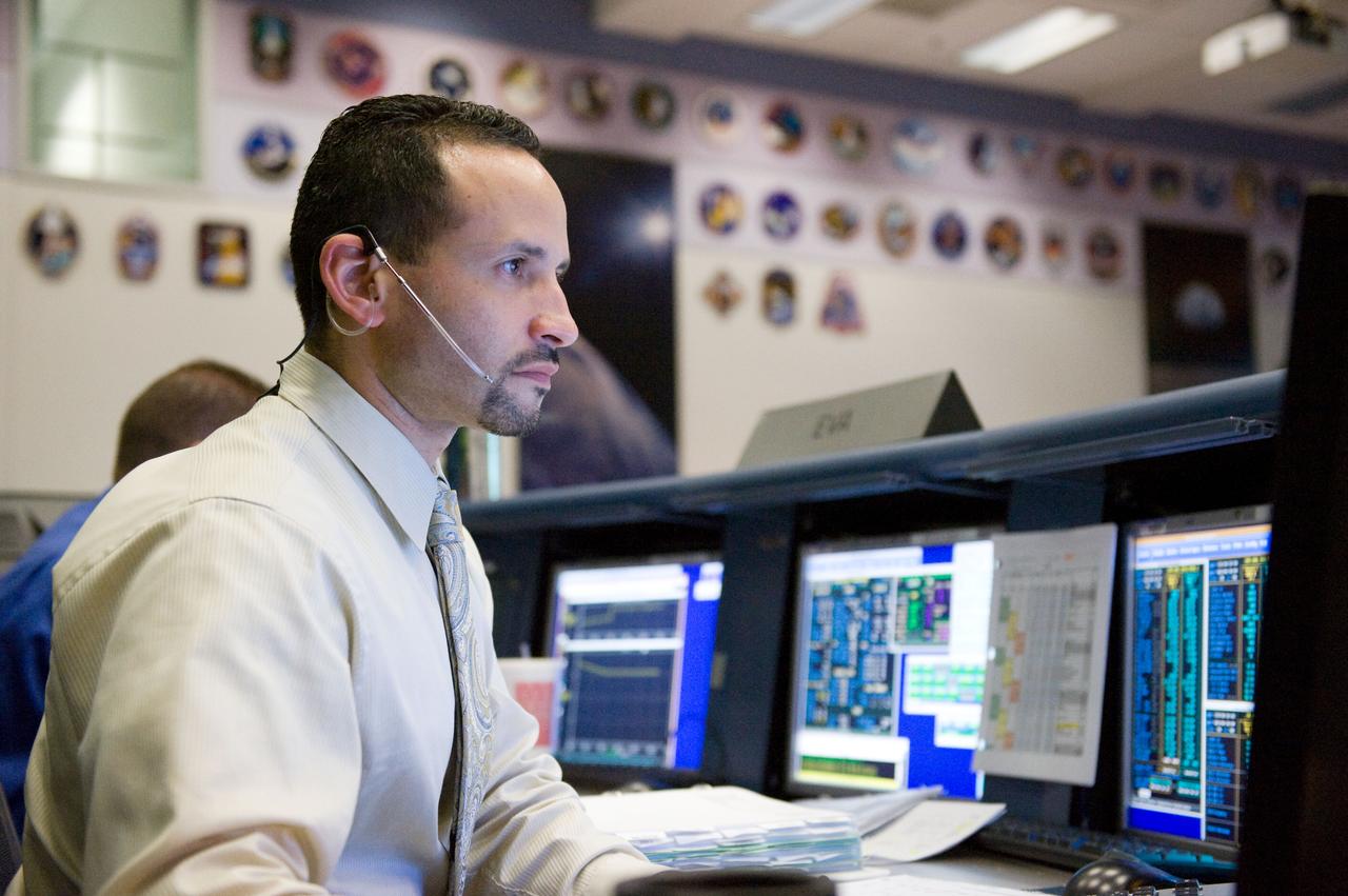 JSC2009-E-119378 (12 May 2009) --- Tomas Gonzalez-Torres, STS-125 lead spacewalk officer, monitors data at his console in the space shuttle flight control room in the Mission Control Center at NASA's Johnson Space Center during flight day two activities.