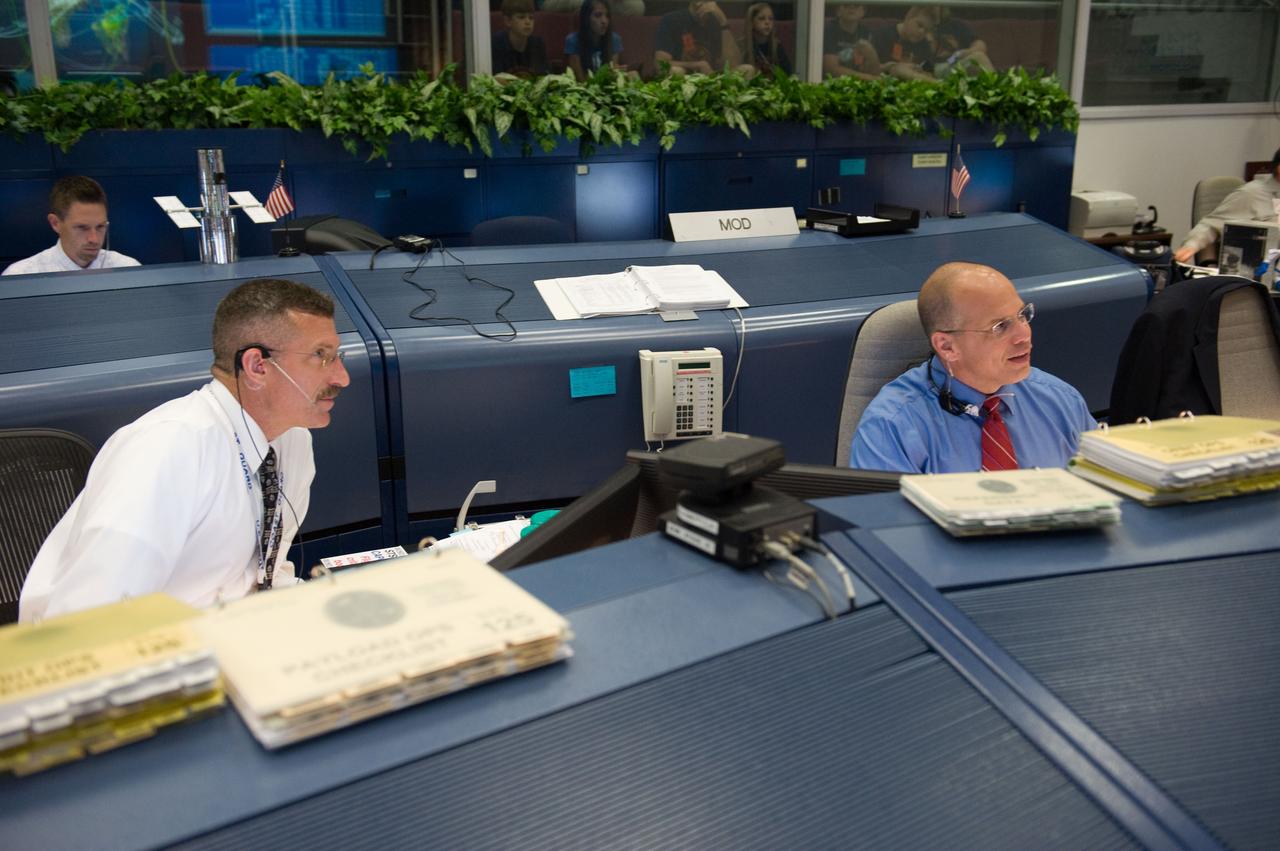 PHOTO DATE: 05-13-09 LOCATION: Bldg. 30 south , WFCR & Backrooms SUBJECT: STS-125 Flight Controllers on Console During HST Grapple - Orbit 1 - Bldg. 30 south.  Flight Director: Tony Ceccacci PHOTOGRAPHER:  JAMES BLAIR