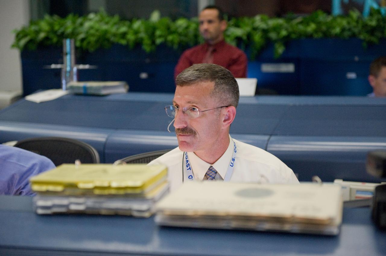 JSC2009-E-120489 (14 May 2009) --- Astronaut Dan Burbank, STS-125 spacecraft communicator (CAPCOM), monitors data at his console in the space shuttle flight control room in the Mission Control Center at NASA's Johnson Space Center during flight day four activities.