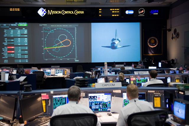 NASA image: STS-125 Entry flight controllers on console with Flight Director Norman Knight 