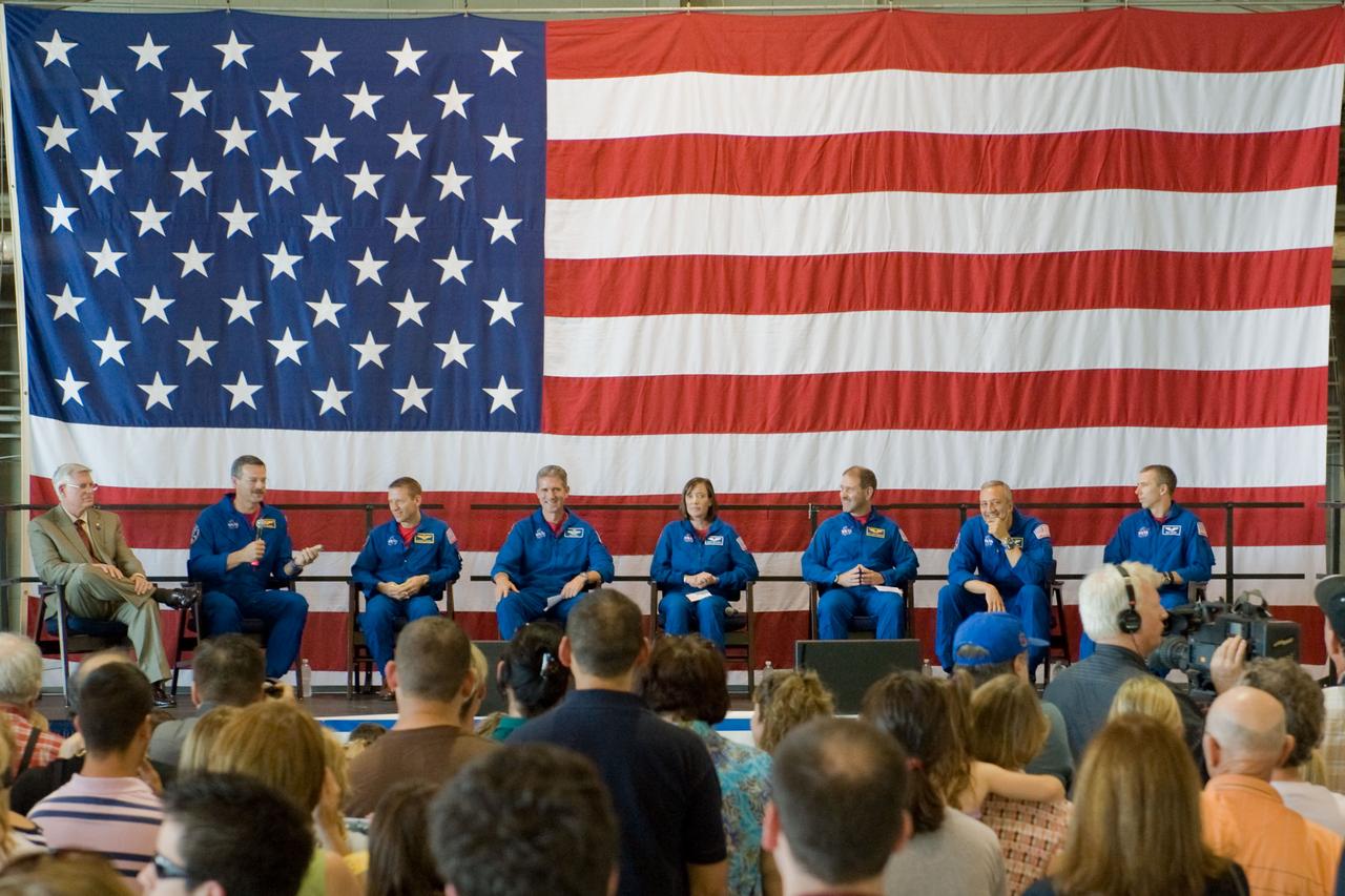JSC2009-E-122153 (26 May 2009) --- NASA's Johnson Space Center (JSC) director Michael L. Coats (far left) and the STS-125 crew are pictured at the STS-125 crew return ceremony on May 26, 2009 at Ellington Field near JSC. From second left are astronauts Scott Altman, commander; Gregory C. Johnson, pilot; along with astronauts Michael Good, Megan McArthur, John Grunsfeld, Mike Massimino and Andrew Feustel, all mission specialists.