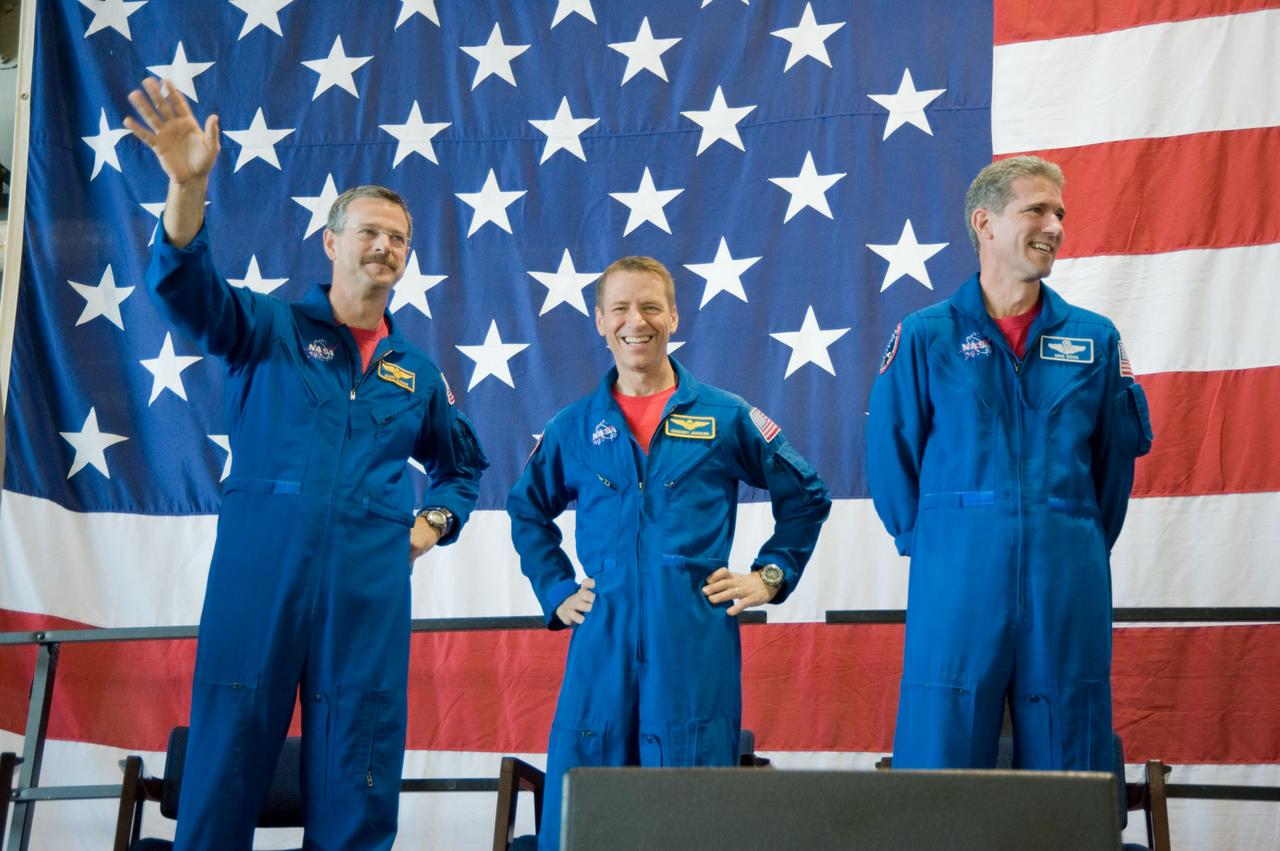 JSC2009-E-122157 (26 May 2009) --- Astronauts Scott Altman (left), STS-125 commander; Gregory C. Johnson, pilot; and Michael Good, mission specialist, are pictured at the STS-125 crew return ceremony on May 26, 2009 at Ellington Field near NASA?s Johnson Space Center.