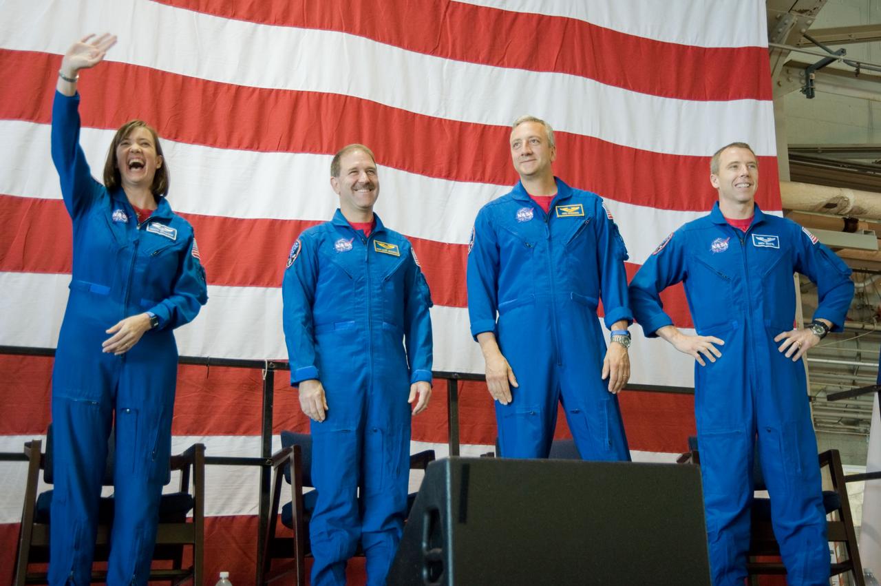 JSC2009-E-122159 (26 May 2009) --- Astronauts Megan McArthur, John Grunsfeld (second left), Mike Massimino and Andrew Feustel, all STS-125 mission specialists, are pictured at the STS-125 crew return ceremony on May 26, 2009 at Ellington Field near NASA?s Johnson Space Center.