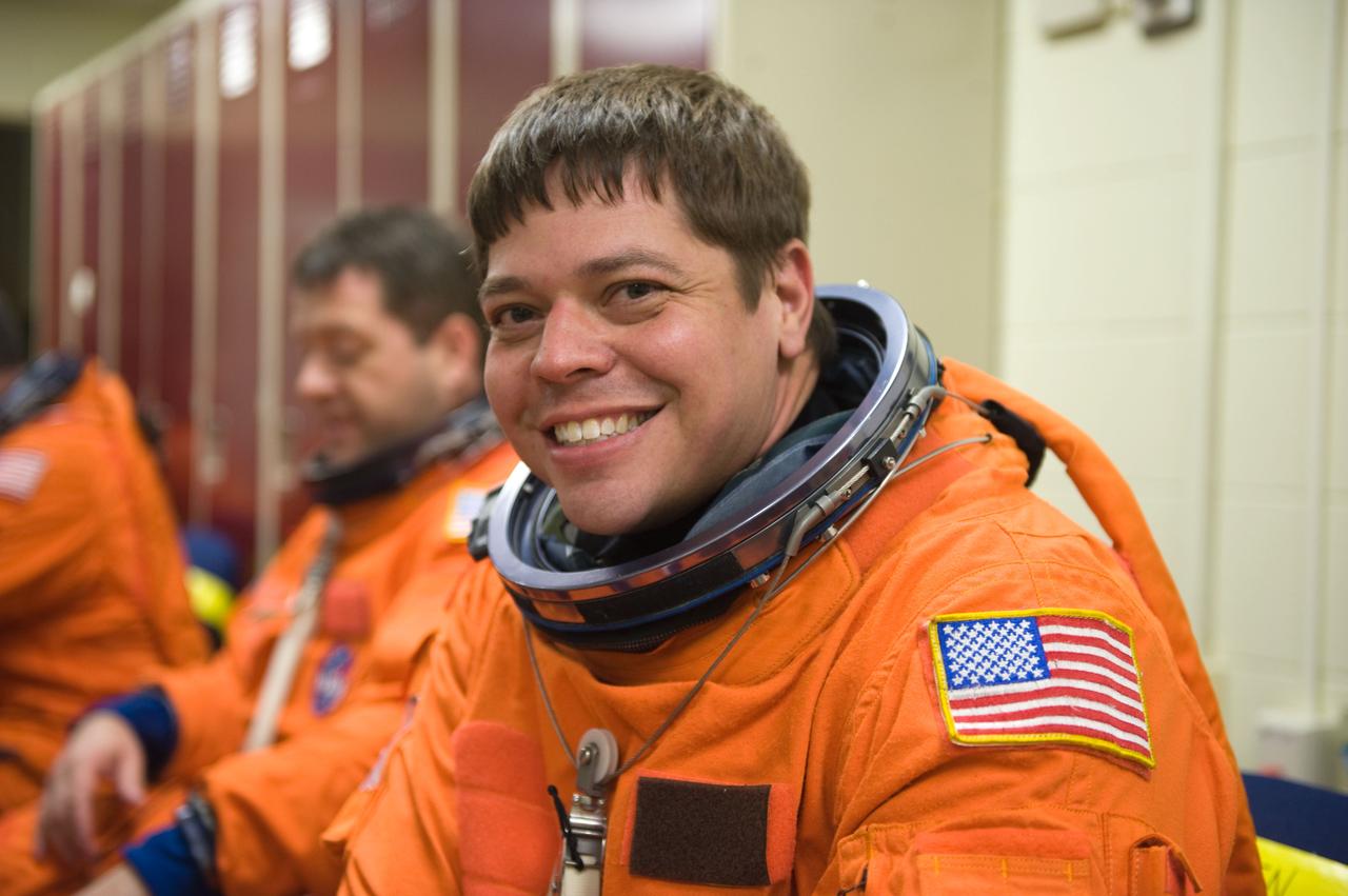 JSC2009-E-125127 (1 June 2009) --- Astronaut Robert Behnken, STS-130 mission specialist, attired in a training version of his shuttle launch and entry suit, awaits the start of a training session in the Space Vehicle Mock-up Facility at NASA?s Johnson Space Center.