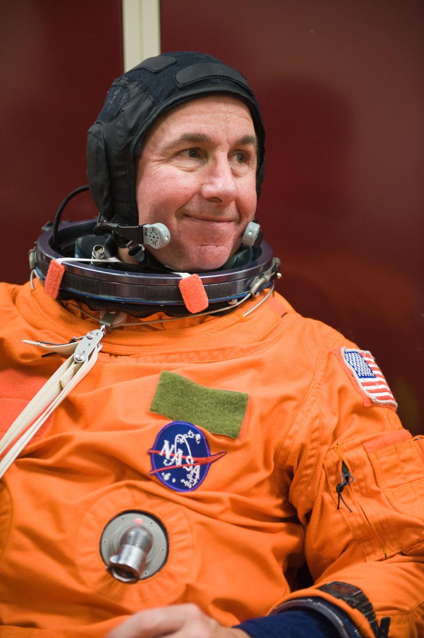 JSC2009-E-125129 (1 June 2009) --- Astronaut Stephen Robinson, STS-130 mission specialist, attired in a training version of his shuttle launch and entry suit, awaits the start of a training session in the Space Vehicle Mock-up Facility at NASA?s Johnson Space Center.