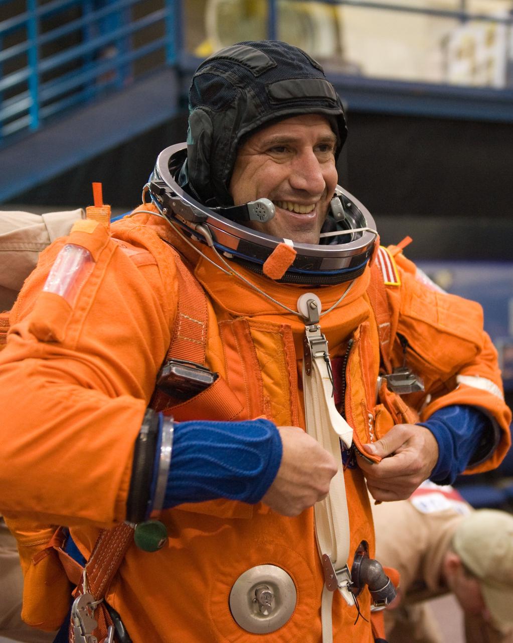 JSC2009-E-125132 (1 June 2009) --- Astronaut George Zamka, STS-130 commander, dons a training version of his shuttle launch and entry suit in preparation for a training session in the Space Vehicle Mock-up Facility at NASA?s Johnson Space Center.