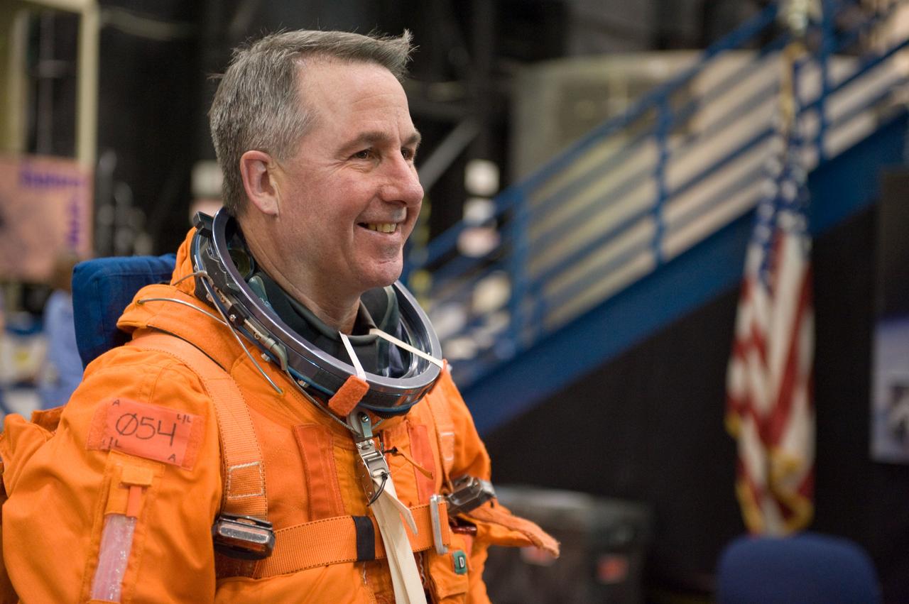JSC2009-E-125142 (1 June 2009) --- Astronaut Stephen Robinson, STS-130 mission specialist, attired in a training version of his shuttle launch and entry suit, awaits the start of a training session in the Space Vehicle Mock-up Facility at NASA?s Johnson Space Center.