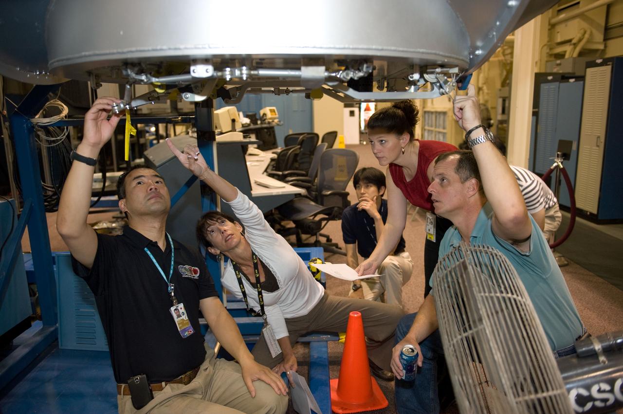 PHOTO DATE:  06-25-09 LOCATION:  Bldg 9NW SUBJECT:  JAXA veteran astronaut and Expedition 22 crew member Soichi Noguichi with JAXA's two new astronaut candidates Takuya Onishi & Kimiya Yui  PHOTOGRAPHER:  James Blair