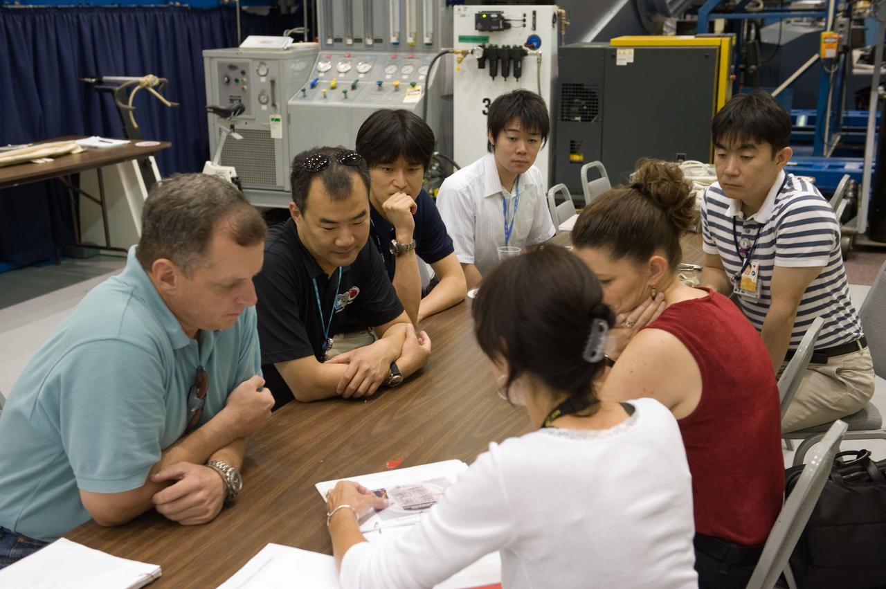 PHOTO DATE:  06-25-09 LOCATION:  Bldg 9NW SUBJECT:  JAXA veteran astronaut and Expedition 22 crew member Soichi Noguichi with JAXA's two new astronaut candidates Takuya Onishi & Kimiya Yui  PHOTOGRAPHER:  James Blair