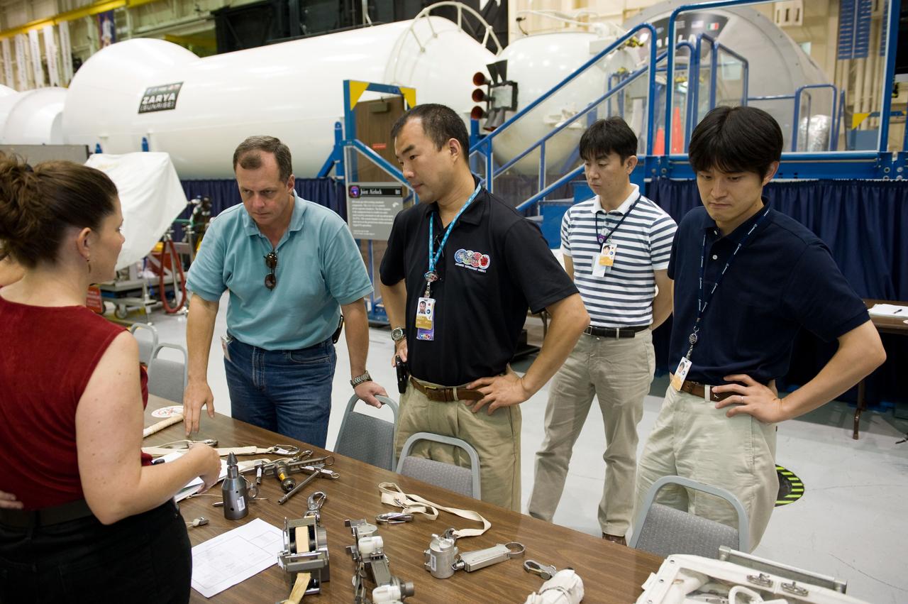 PHOTO DATE:  06-25-09 LOCATION:  Bldg 9NW SUBJECT:  JAXA veteran astronaut and Expedition 22 crew member Soichi Noguichi with JAXA's two new astronaut candidates Takuya Onishi & Kimiya Yui  PHOTOGRAPHER:  James Blair