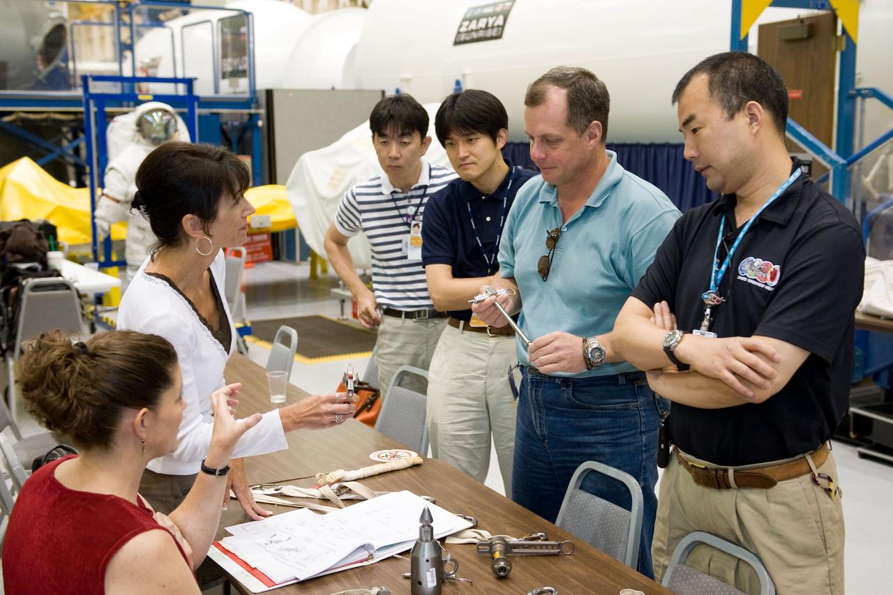 PHOTO DATE:  06-25-09 LOCATION:  Bldg 9NW SUBJECT:  JAXA veteran astronaut and Expedition 22 crew member Soichi Noguichi with JAXA's two new astronaut candidates Takuya Onishi & Kimiya Yui  PHOTOGRAPHER:  James Blair