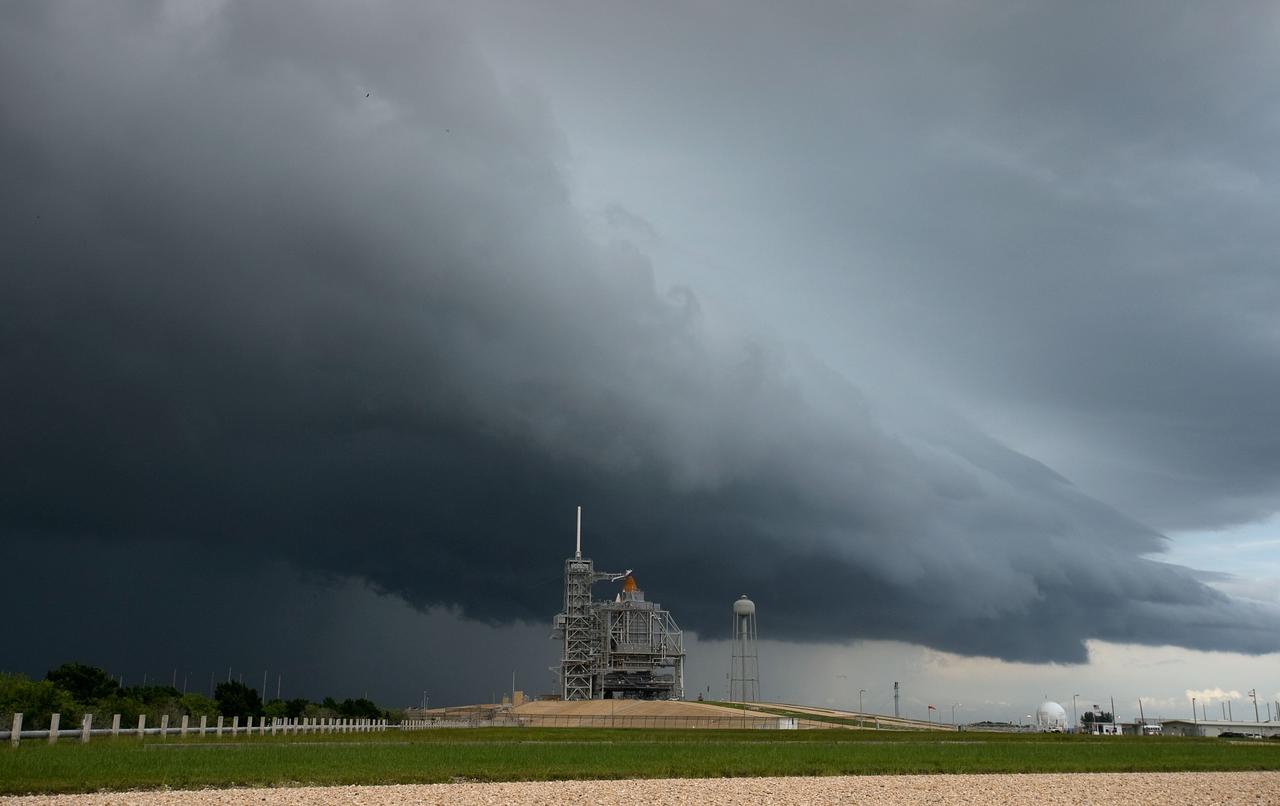 Storm clouds approach Launch Pad 39A at NASA's Kennedy Space Center in Florida on Friday, July 10, 2009 as space shuttle Endeavour stands awaiting Saturday's planned launch of the STS-127 mission. Photo Credit: (NASA/Bill Ingalls)