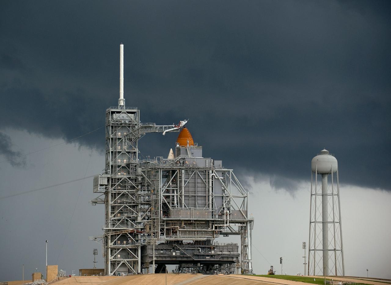 Storm clouds approach Launch Pad 39A at NASA's Kennedy Space Center in Florida on Friday, July 10, 2009 as space shuttle Endeavour stands awaiting Saturday's planned launch of the STS-127 mission. Photo Credit: (NASA/Bill Ingalls)