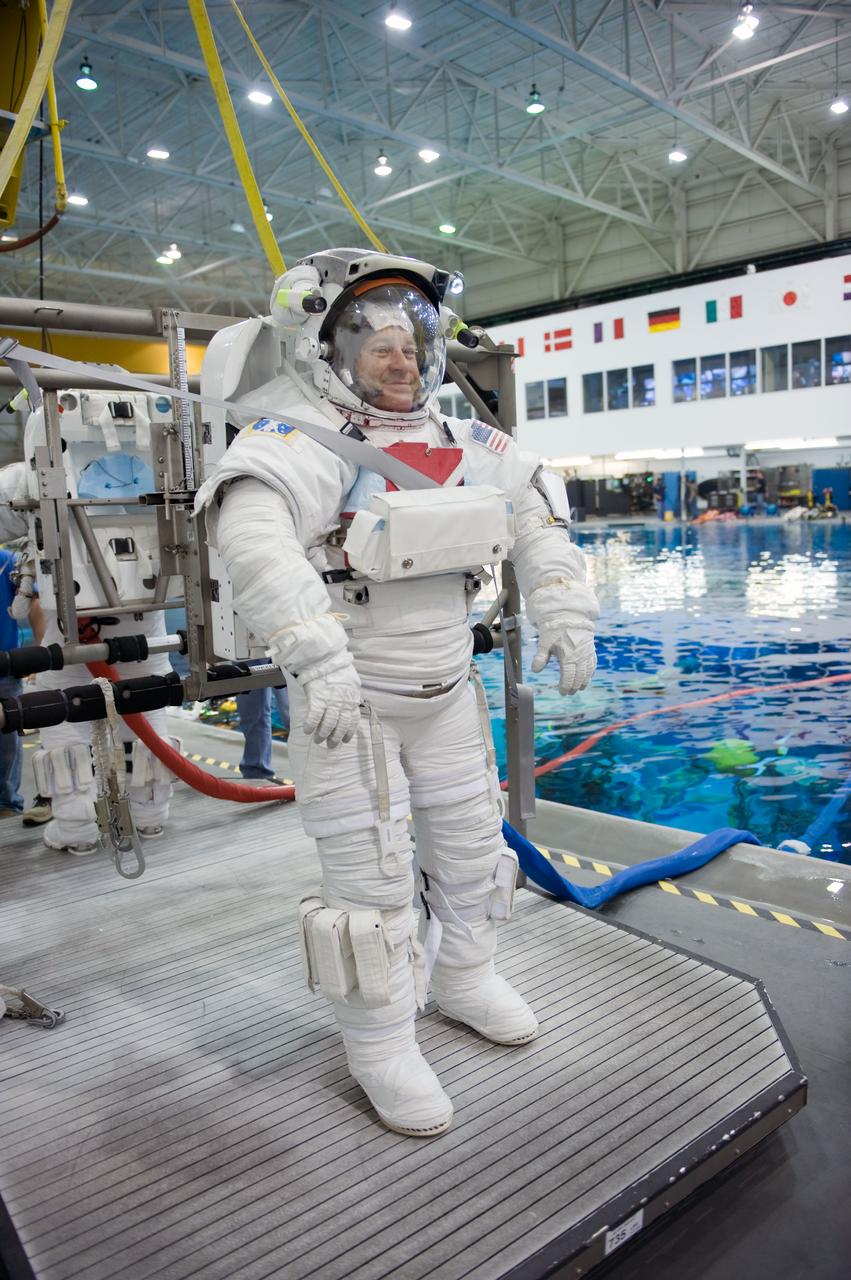 JSC2009-E-145710 (17 July 2009) --- Astronaut Nicholas Patrick, STS-130 mission specialist, attired in a training version of his Extravehicular Mobility Unit (EMU) spacesuit, awaits the start of a spacewalk training session in the waters of the Neutral Buoyancy Laboratory (NBL) near NASA's Johnson Space Center.