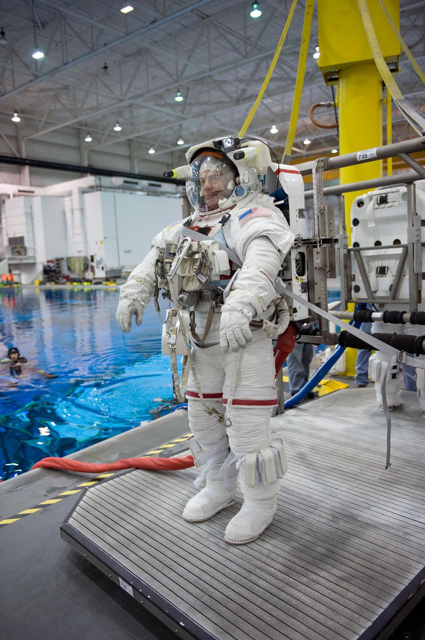 JSC2009-E-145715 (17 July 2009) --- Astronaut Robert Behnken, STS-130 mission specialist, attired in a training version of his Extravehicular Mobility Unit (EMU) spacesuit, awaits the start of a spacewalk training session in the waters of the Neutral Buoyancy Laboratory (NBL) near NASA's Johnson Space Center.