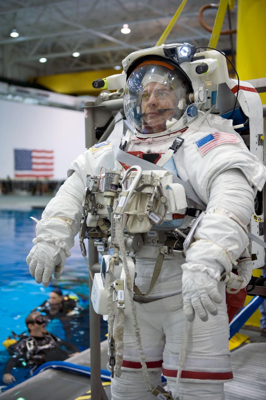 JSC2009-E-145717 (17 July 2009) --- Astronaut Robert Behnken, STS-130 mission specialist, attired in a training version of his Extravehicular Mobility Unit (EMU) spacesuit, awaits the start of a spacewalk training session in the waters of the Neutral Buoyancy Laboratory (NBL) near NASA's Johnson Space Center.