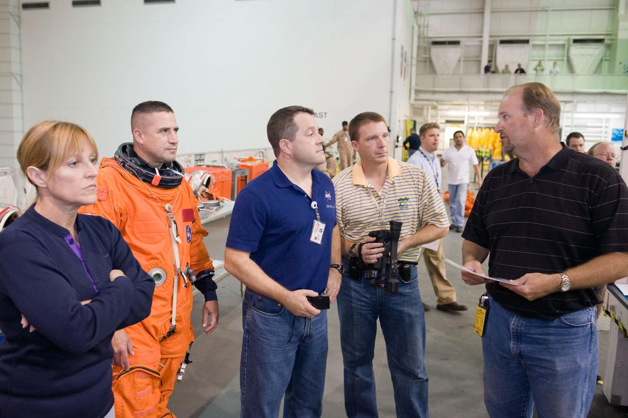 JSC2009-E-155118 (24 Aug. 2009) --- United Space Alliance crew trainer Robert (Rob) Tomaro (far right) briefs astronauts Kathryn Hire, STS-130 mission specialist; George Zamka (second left), commander; Nicholas Patrick, mission specialist; and Terry Virts Jr., pilot, during a training session in the Neutral Buoyancy Laboratory (NBL) near NASA's Johnson Space Center. Zamka is wearing a training version of his shuttle launch and entry suit.
