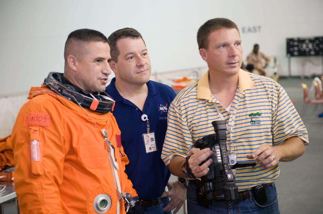 JSC2009-E-155120 (24 Aug. 2009) --- Astronauts George Zamka (left), STS-130 commander; Nicholas Patrick, mission specialist; and Terry Virts Jr., pilot, are pictured during a training session in the Neutral Buoyancy Laboratory (NBL) near NASA's Johnson Space Center. Zamka is wearing a training version of his shuttle launch and entry suit.