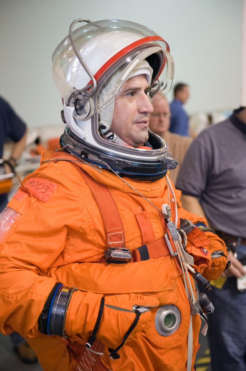 JSC2009-E-155124 (24 Aug. 2009) --- Attired in a training version of his shuttle launch and entry suit, astronaut George Zamka, STS-130 commander, awaits the start of a water survival training session in the waters of the Neutral Buoyancy Laboratory (NBL) near NASA's Johnson Space Center.