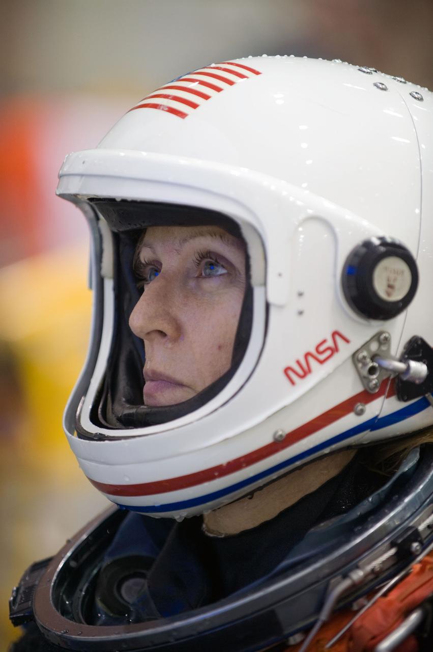 JSC2009-E-155194 (24 Aug. 2009) --- Astronaut Kathryn Hire, STS-130 mission specialist, attired in a training version of her shuttle launch and entry suit, is pictured during a water survival training session in the Neutral Buoyancy Laboratory (NBL) near NASA's Johnson Space Center.
