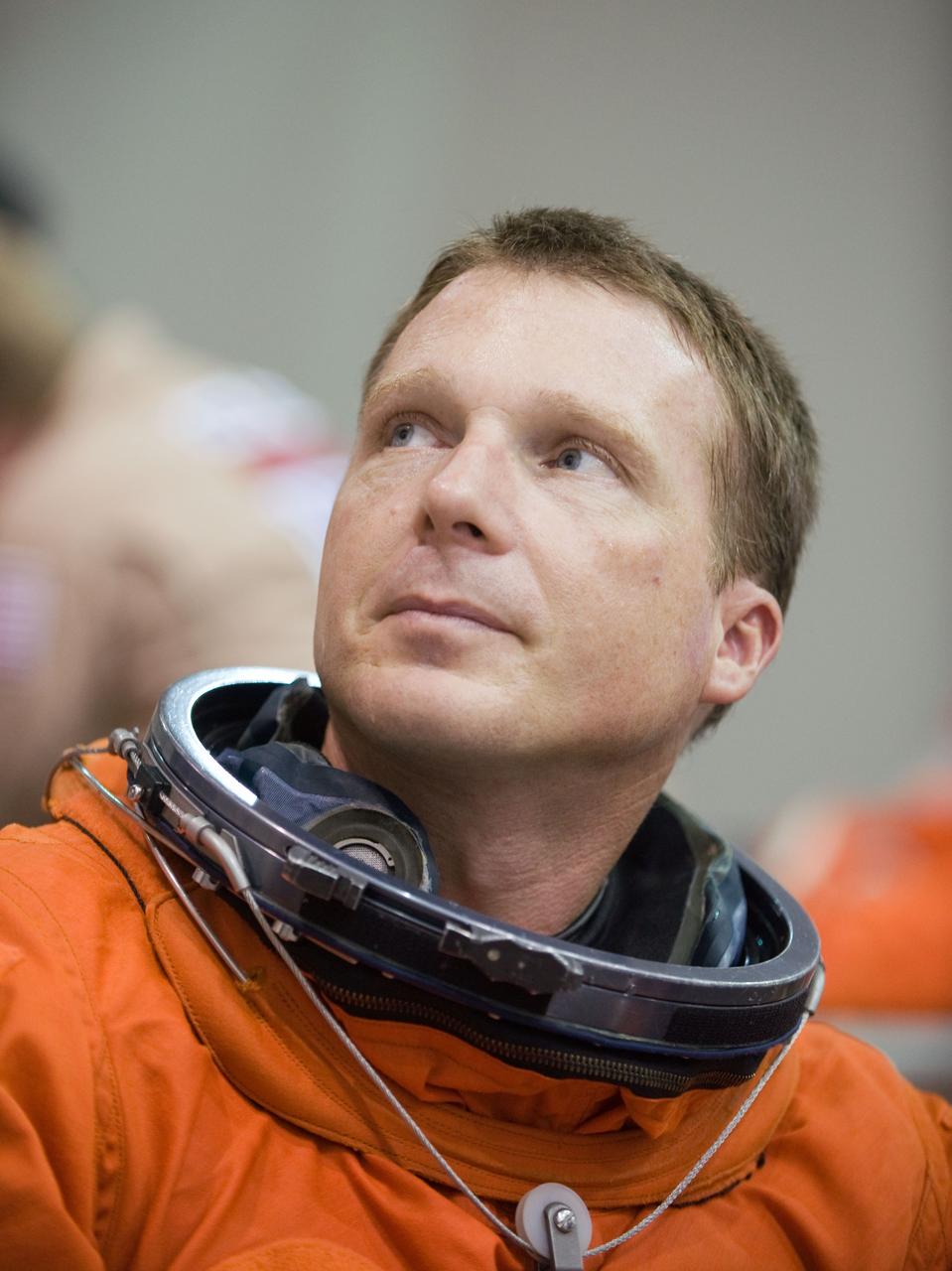 JSC2009-E-155198 (24 Aug. 2009) --- Astronaut Terry Virts Jr., STS-130 pilot, attired in a training version of his shuttle launch and entry suit, awaits the start of a water survival training session in the waters of the Neutral Buoyancy Laboratory (NBL) near NASA's Johnson Space Center.
