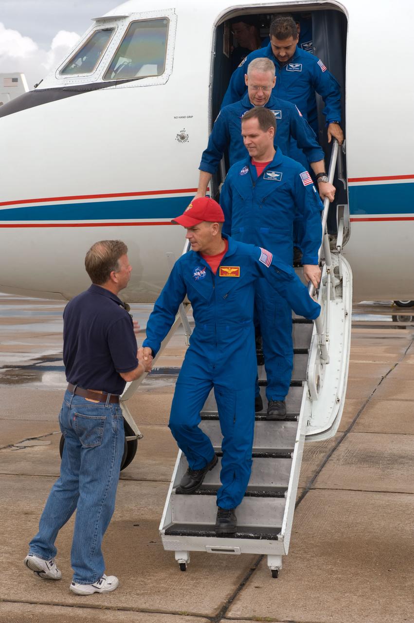 JSC2009-E-207787 (12 Sept. 2009) --- Stephen Lindsey, chief of the astronaut office, greets NASA astronaut Rick Sturckow, STS-128 commander, as the STS-128 crew members exit a Gulfstream aircraft prior to the crew return ceremonies at Ellington Field near NASA?s Johnson Space Center. Pictured behind Sturckow (front to back) are NASA astronauts Kevin Ford, pilot; Patrick Forrester and Jose Hernandez, both mission specialists. Crew members not pictured are NASA astronauts John ?Danny? Olivas and Tim Kopra; along with European Space Agency astronaut Christer Fuglesang, all mission specialists.